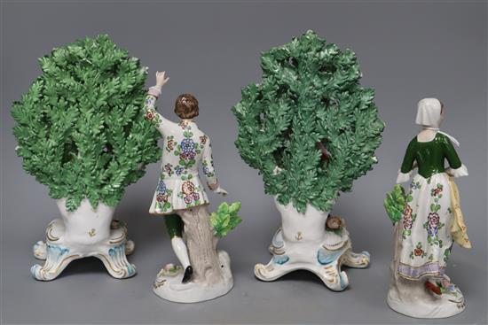 A Sitzendorf pair of shepherd and shepherdess figures holding flowers and a pair of Samson Chelsea style bocage figures